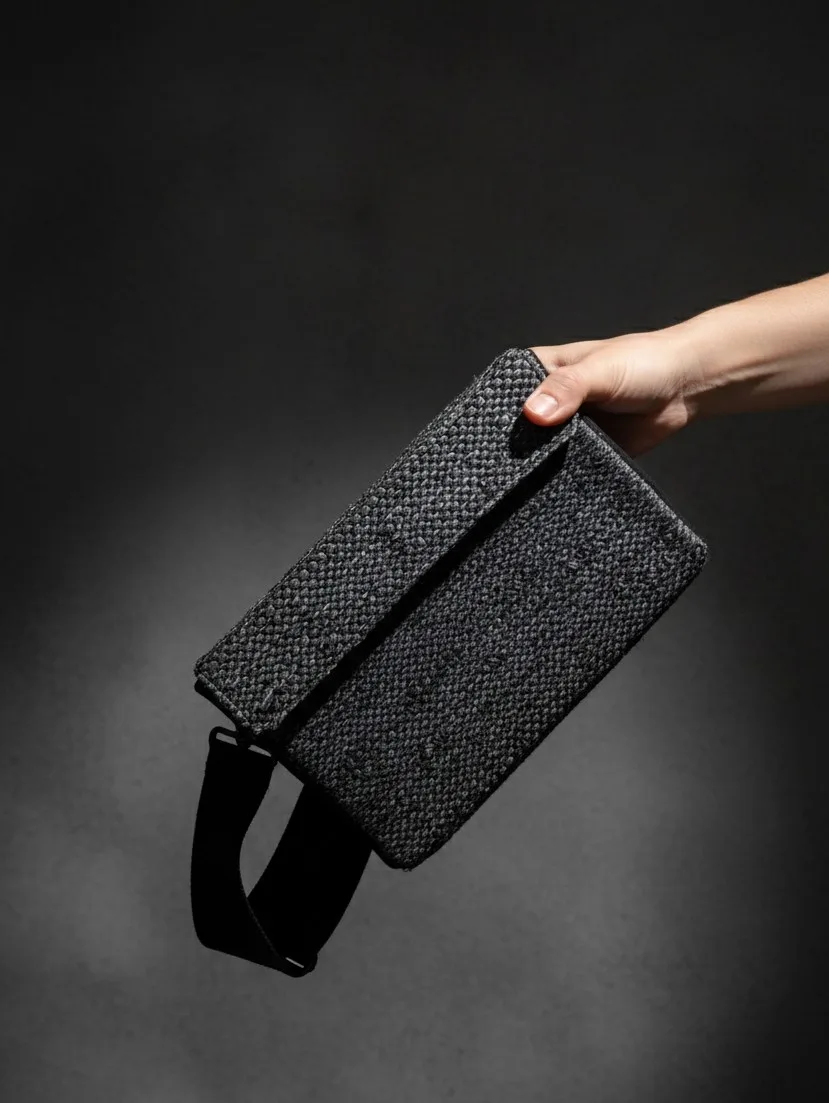 Blue handwoven clutch — detail of woven recycled fabric pattern