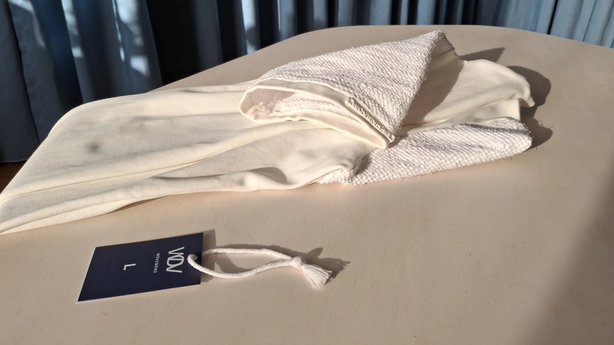 White Solitaire t-shirt — woven sleeve detail and WOVENRAG label