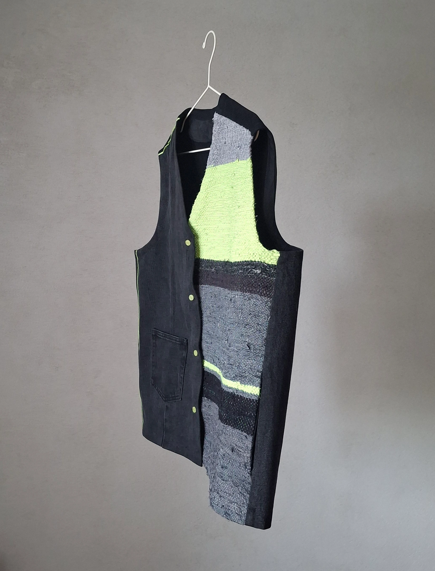 Handwoven upcycled vest with a charcoal denim body and a neon-green, grey and black woven panel